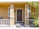 Welcoming covered porch with decorative columns and a 'hello' wreath on the front door at 3793 Cadence Dr, Castle Rock, CO 80109