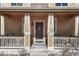Inviting front porch featuring a decorative door and seating at 3793 Cadence Dr, Castle Rock, CO 80109