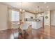 Open concept kitchen and dining area with hardwood floors at 3793 Cadence Dr, Castle Rock, CO 80109