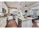 Bright kitchen features island with seating and stainless steel appliances at 3793 Cadence Dr, Castle Rock, CO 80109