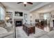 Living room features a fireplace and view to a dining room at 3793 Cadence Dr, Castle Rock, CO 80109