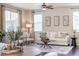 Bright living room with large windows, modern decor, and hardwood floors at 3793 Cadence Dr, Castle Rock, CO 80109