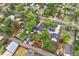 Beautiful aerial view of a fenced yard with a cozy home and storage sheds at 5553 S Datura St, Littleton, CO 80120