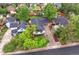 Aerial view of the home with mature trees and landscaping at 5553 S Datura St, Littleton, CO 80120