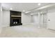 Basement with a dark fireplace, recessed lights and neutral carpet at 5553 S Datura St, Littleton, CO 80120