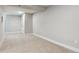 Basement with neutral carpet and white trim at 5553 S Datura St, Littleton, CO 80120
