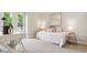 Bright bedroom with a dedicated work space, large window, and calming decor at 5553 S Datura St, Littleton, CO 80120
