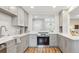 Contemporary kitchen with white countertops and stainless steel appliances at 5553 S Datura St, Littleton, CO 80120