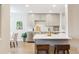 Modern kitchen with stainless steel appliances and a breakfast bar at 5553 S Datura St, Littleton, CO 80120