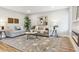 Comfortable living room featuring stylish sofas and a decorative rug at 5553 S Datura St, Littleton, CO 80120
