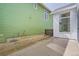 Green-sided home with concrete pathway to a white-sided home at 918 Promenade Dr, Superior, CO 80027