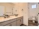 Modern bathroom features double sinks, large mirrors, and a separate toilet room at 918 Promenade Dr, Superior, CO 80027