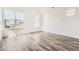 Bright bedroom with a large window and wood-look floors at 918 Promenade Dr, Superior, CO 80027
