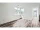 Well lit bedroom boasts hardwood floors and two large windows at 918 Promenade Dr, Superior, CO 80027