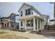 Charming two-story home with a covered front porch, white siding, and modern design at 918 Promenade Dr, Superior, CO 80027