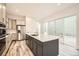 Modern kitchen featuring a large island, stainless steel appliances, and ample counter space at 918 Promenade Dr, Superior, CO 80027