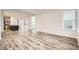 Open-concept living area featuring stylish wood-look floors and ample natural light at 918 Promenade Dr, Superior, CO 80027