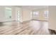 Bright living room with stylish wood-look floors and contemporary finishes at 918 Promenade Dr, Superior, CO 80027