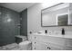 Stylish bathroom with a tiled walk-in shower and modern vanity at 1150 S Taos Way, Denver, CO 80223