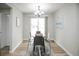 Cozy dining room with natural light, modern chandelier, and seamless access to the outdoor patio at 1150 S Taos Way, Denver, CO 80223