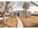 Cozy home featuring a well manicured yard, a paved walkway, and plenty of curb appeal at 1150 S Taos Way, Denver, CO 80223