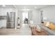 Open-concept living area featuring modern decor, stainless steel refrigerator, and seamless flow into the dining area at 1150 S Taos Way, Denver, CO 80223