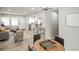 Open-concept living room featuring modern furnishings and light wood flooring at 1150 S Taos Way, Denver, CO 80223
