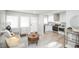 Bright living room with neutral decor, seamlessly connected to a modern kitchen at 1150 S Taos Way, Denver, CO 80223