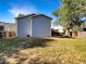 Spacious backyard with mature trees and partial fence, offering privacy and room for recreation at 542 Hawthorn Cir, Frederick, CO 80530