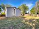 Large backyard with mature trees and ample green space, perfect for outdoor activities at 542 Hawthorn Cir, Frederick, CO 80530