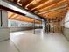 Unfinished basement with painted floor and exposed ductwork and framing is great for storage and customization at 542 Hawthorn Cir, Frederick, CO 80530