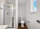 Clean bathroom featuring a shower with glass doors, tile accents, and modern fixtures at 542 Hawthorn Cir, Frederick, CO 80530