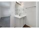 Bright bathroom features a white vanity with a large mirror and modern lighting at 542 Hawthorn Cir, Frederick, CO 80530