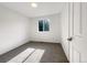 Bedroom with neutral walls, carpet, and a window offering natural light at 542 Hawthorn Cir, Frederick, CO 80530