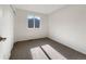 This bedroom has neutral walls and carpet, a closet, and a window providing natural light at 542 Hawthorn Cir, Frederick, CO 80530