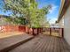 Wooden deck with red railing, providing a space for outdoor entertaining and relaxation at 542 Hawthorn Cir, Frederick, CO 80530