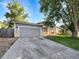 Beautiful exterior view of a home featuring a two-car garage, well-kept lawn, and mature trees at 542 Hawthorn Cir, Frederick, CO 80530