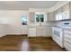 Well-lit kitchen featuring sleek appliances, neutral cabinetry, and vinyl flooring at 542 Hawthorn Cir, Frederick, CO 80530
