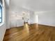 Bright and airy living room with beautiful hardwood floors and fresh white walls at 542 Hawthorn Cir, Frederick, CO 80530