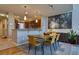 Dining area with modern decor, seamlessly connected to the open-concept kitchen at 11257 W Radcliffe Dr, Littleton, CO 80127