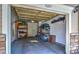 Clean garage equipped with storage shelves and room for parking, ready for your vehicles and hobbies at 11257 W Radcliffe Dr, Littleton, CO 80127