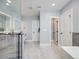 Bright bathroom showcasing modern fixtures, marble floors, and a glass shower at 3948 Wyandot St, Denver, CO 80211