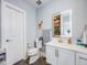 Stylish bathroom featuring a modern vanity, bright mirror, and sleek fixtures at 3948 Wyandot St, Denver, CO 80211