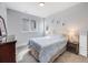 Light and airy bedroom with a plush bed, soft carpet, and serene decor at 3948 Wyandot St, Denver, CO 80211