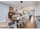 Open-concept kitchen and dining area with hardwood floors and modern pendant lighting at 3948 Wyandot St, Denver, CO 80211