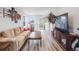 Comfortable living room featuring new floors, large TV, and an open layout at 3948 Wyandot St, Denver, CO 80211