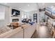 Spacious living room with a fireplace, large windows, comfortable seating, hardwood floors, and an open floor plan at 3948 Wyandot St, Denver, CO 80211