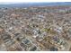 A vast neighborhood view with streets, homes, and the mountains on the horizon at 3948 Wyandot St, Denver, CO 80211