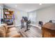 Bright office space featuring wood-look floors, large window and desk at 3948 Wyandot St, Denver, CO 80211