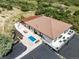 Aerial view showcasing the house, pool, patio, and pristine landscaping in a private setting at 1140 Lake Gulch Rd, Castle Rock, CO 80104